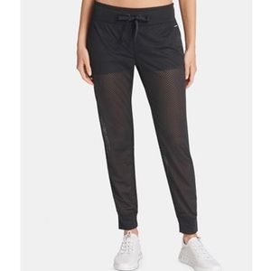 Super cool mesh DKNY joggers with inserted shorts.